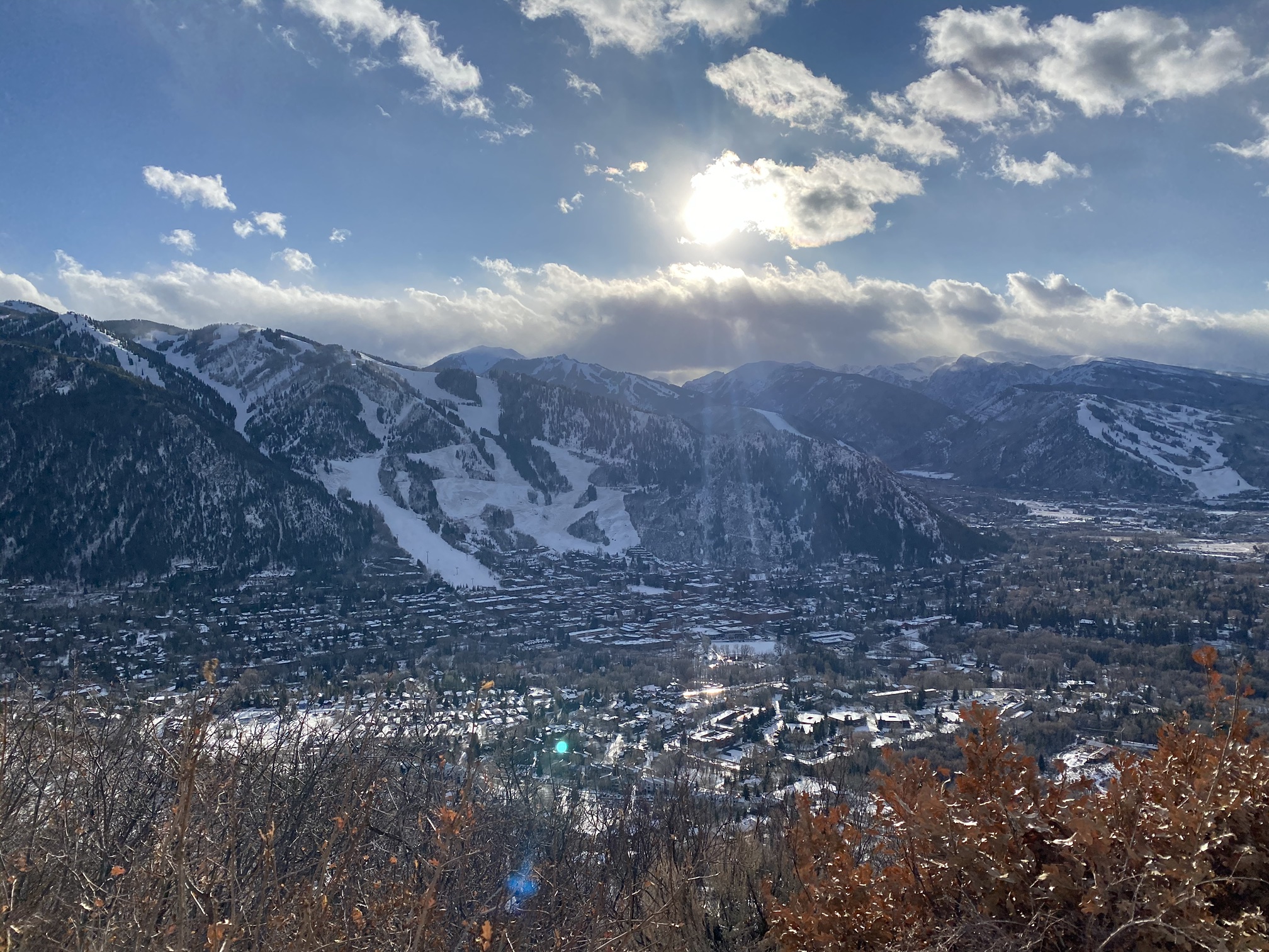 Aspen in winter seen from the top of Smuggler Mountain, with the ski runs of Aspen Mountain rising above town